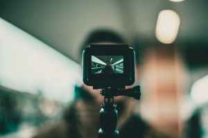 black action camera with stand