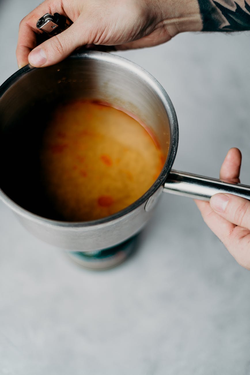photo of person holding pot